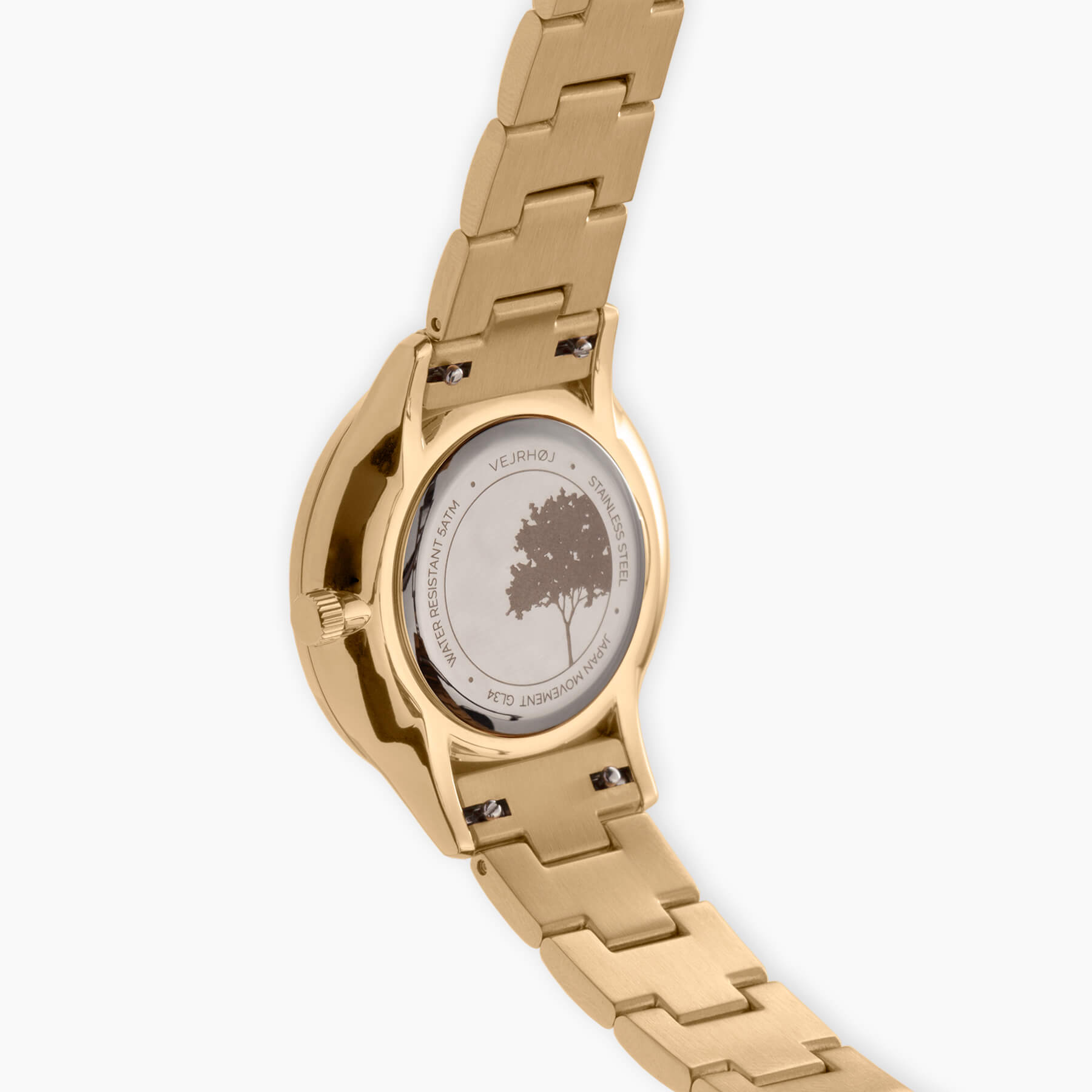 Petite Royal Blueの裏面、VEJRHØJのアイコンである木のイラストが彫刻されたステンレス製ケースバックとメタルバンド