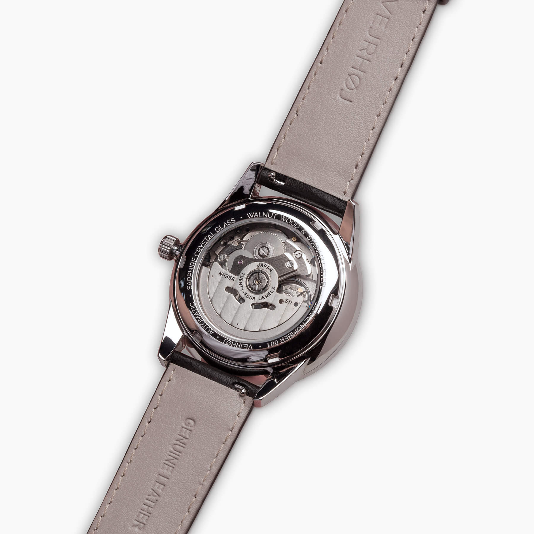 黒ベルトの自動巻式腕時計の透明な裏